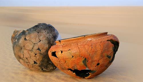 Photo shows vessels that have been restored from fragments found in the Libyan Sahara thought to be more than 6,000 years old.