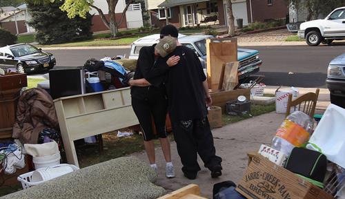 A family’s possessions spread across their lawn after they were evicted from their rented home.