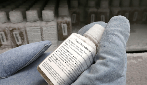 Photograph shows a technician holding a plastic bottle containing a frozen solution of donated stool for use in fecal transplants, which are increasingly being used to fight hard-to-treat gut infections.